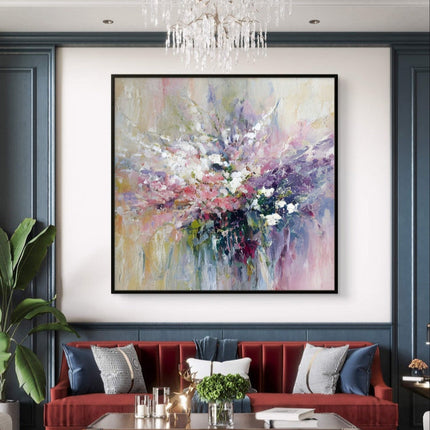 Living room with a red sofa, abstract painting, and chandelier.