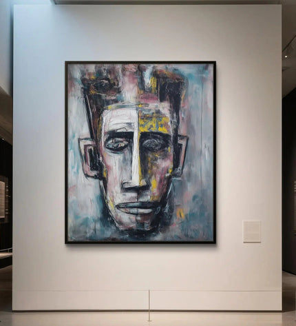 Abstract painting of a face on a wall in an art gallery