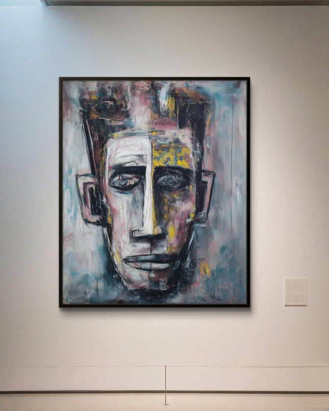 Abstract painting of a face on a wall in an art gallery