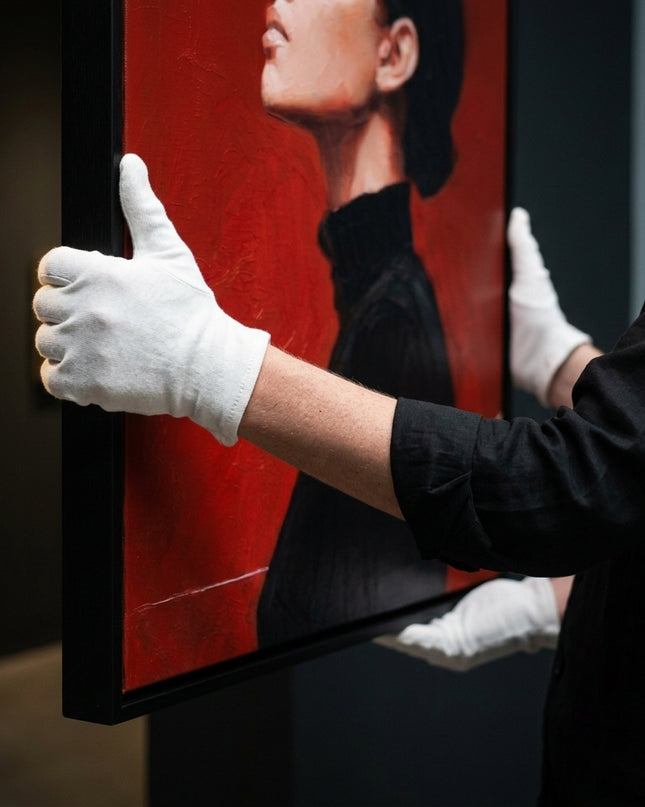 Art handler presenting Crimson Reverie large-format original painting
