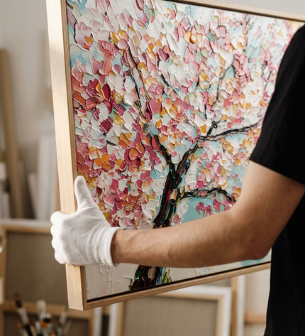 Art handler presenting Cherry Sky large-format original painting