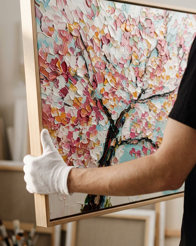 Art handler presenting Cherry Sky large-format original painting