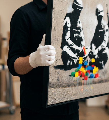 Art handler presenting Peace Builders large-format original painting