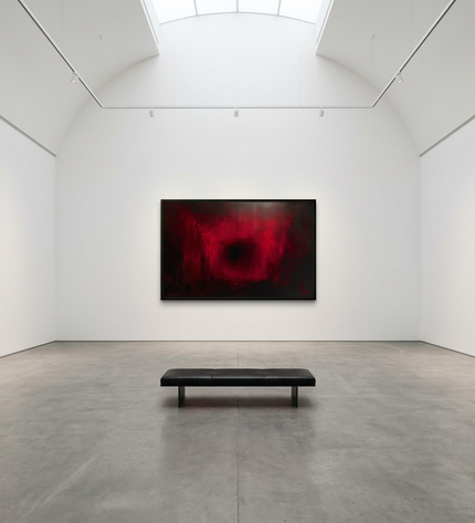 Ruby Glow hand-painted abstract painting displayed in a gallery-style space with a large wall