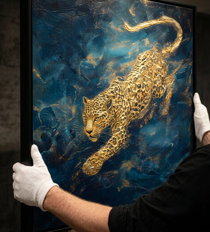 Goldstrike original oil painting held by a gallerist with white cotton gloves, golden leopard impasto close-up