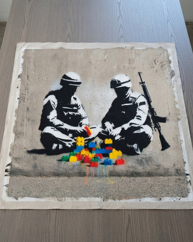Peace Builders hand-painted original as unrolled canvas on studio table, shown without frame