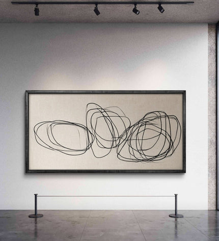 Abstract art piece on a wall in a gallery setting