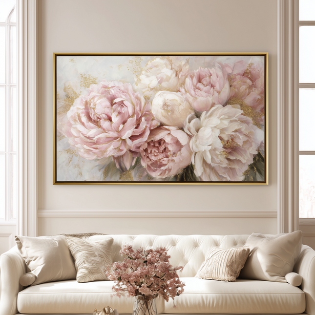 Living room with a white sofa, coffee table, and floral artwork on the wall.