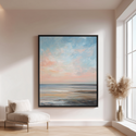 Framed abstract painting of a sunset over water in a modern living room.